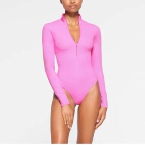 NWOT SKIMS Fits Everybody Half Zip Pink Bodysuit